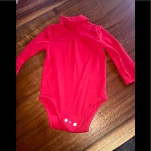 Cute turtleneck onesie.